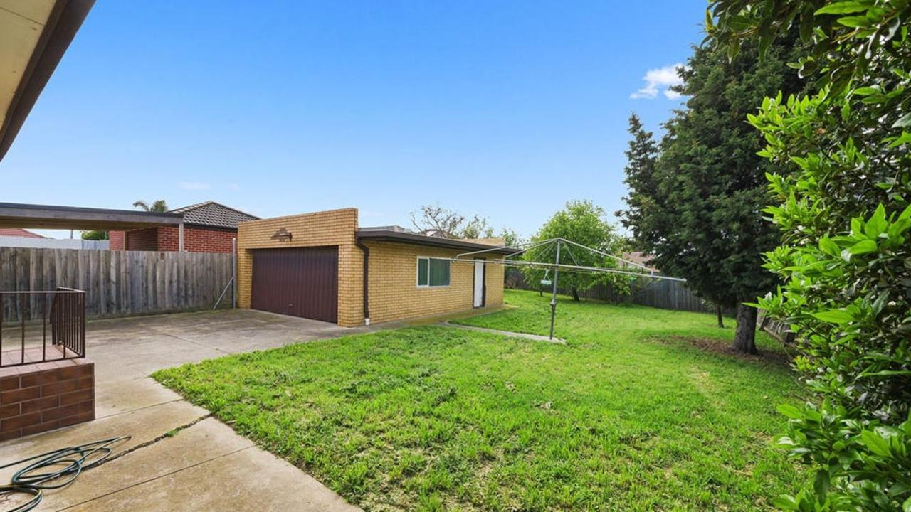 The spacious back yard with a classic Hills hoist clothesline.