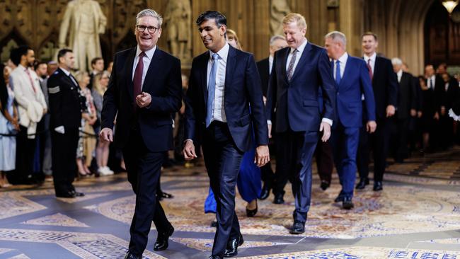 Prime Minister Sir Keir Starmer (left) and Conservative leader Rishi Sunak (right) lead MPs through the Central Lobby at the Palace of Westminster ahead of the State Opening of Parliament on July 17, 2024 in London, England. King Charles III delivers the King's Speech setting out the new Labour government's policies and proposed legislation for the coming parliamentary session. Picture: Dan Kitwood/Getty Images