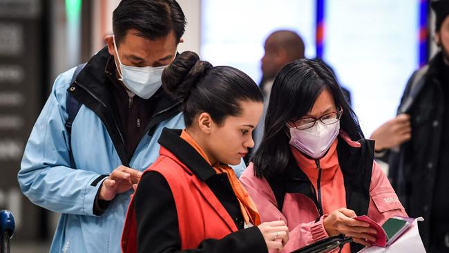 A young female Chinese student is likely to be the fifth person in Australia to contract the deadly coronavirus, health authorities say. (Photo by Alain JOCARD / AFP)