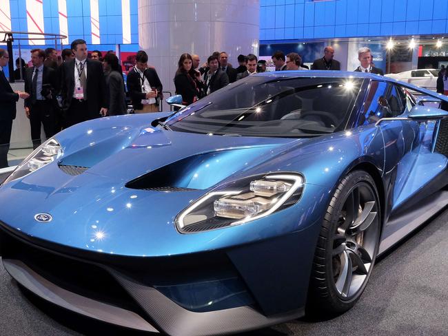 The new Ford GT is pictured at The North American International Auto Show in Detroit, Michigan, on January 12, 2015. Ford attempted to land a knock-out blow to its rivals at the Detroit auto show in revealing a dazzling new GT supercar. The annual car show takes place amid a surging economy, more jobs and cheap gas, a trifecta of near-perfect conditions for the US auto industry. AFP PHOTO/JEWEL SAMAD