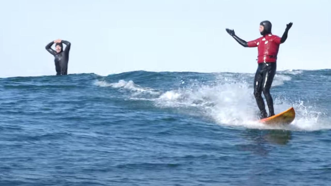 The reaction of Peter Mel and the surfer in the background is amazing.