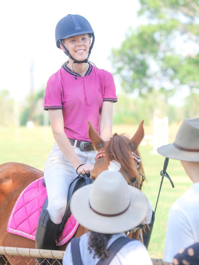 Mikayla Hunt, 19, enjoying day two of the Royal Darwin Show. Picture: Glenn Campbell