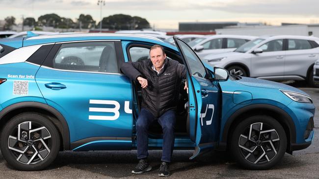 Mark Harland, chief operating officer of BYD distributor EV Direct, with hundreds of electric cars. Picture: Alex Coppel.