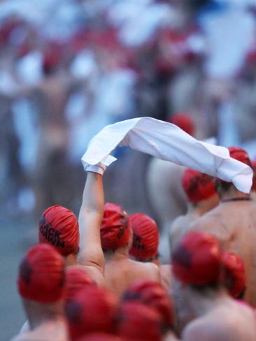 Towels come off before the swim. Picture: NIKKI DAVIS-JONES