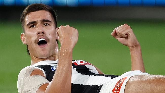 MELBOURNE, AUSTRALIA - MARCH 21: Reef McInnes of the Magpies celebrates a goal during the 2024 AFL Round 02 match between the St Kilda Saints and the Collingwood Magpies at the Melbourne Cricket Ground on March 21, 2024 in Melbourne, Australia. (Photo by Michael Willson/AFL Photos via Getty Images)