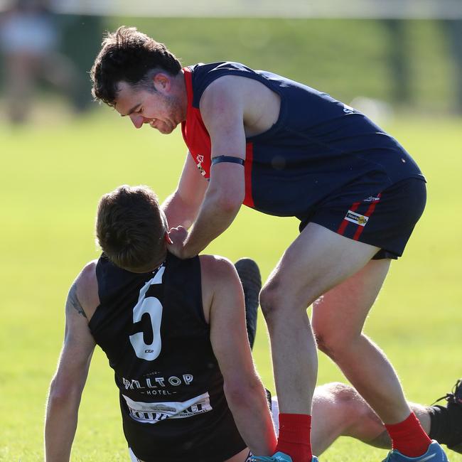 Swifts Creek’s Beau Hack and Omeo-Benambra’s Campbell Ah Sam get up close.