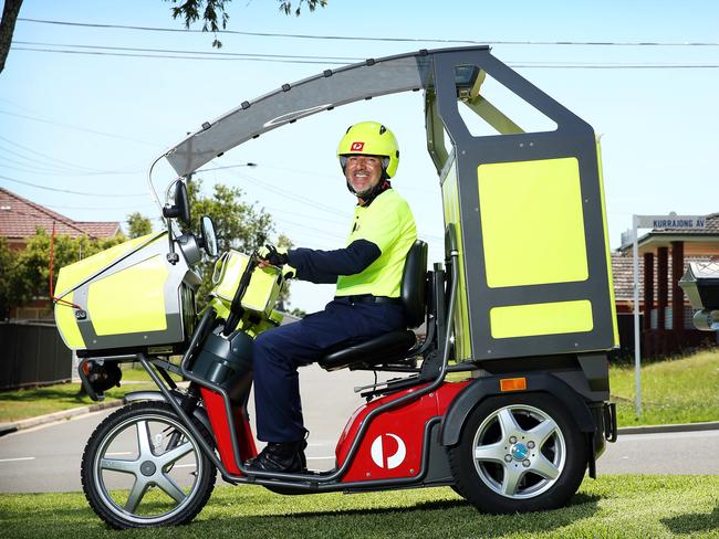 Postie John Alvarez on the new motorised mopeds. Picture: Tim Hunter