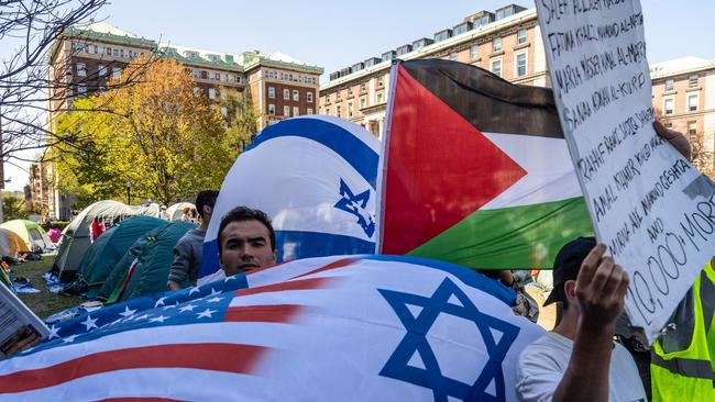 NEW YORK, NEW YORK – APRIL 23: Pro-Israel students stand nearby as Columbia University students participate in an ongoing pro-Palestinian encampment on their campus. Picture: Getty Images