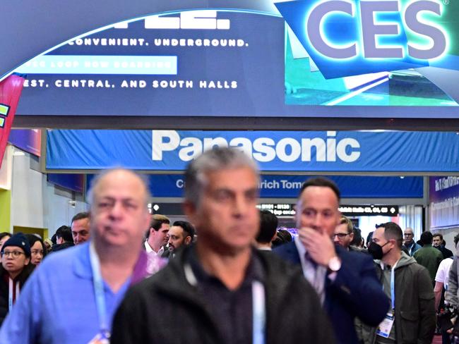 People make their way throgh showfloors at the Las Vegas Convention Center during the Consumer Electronics Show (CES) in Las Vegas, Nevada, on January 11, 2024. (Photo by Frederic J. BROWN / AFP)