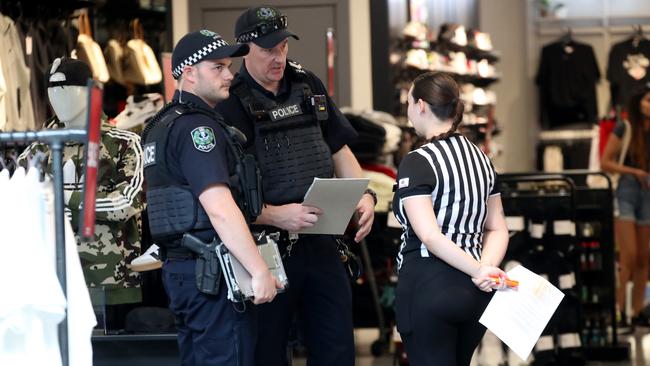 Police at the Rundle Mall Footlocker store after thieves threatened staff with an axe and stole goods. Picture: Kelly Barnes