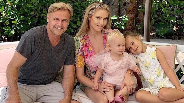 Siimon Reynolds at his home in Los Angeles on Monday with wife Kathryn Eisman and children Capri, 6, and Monet, 2.