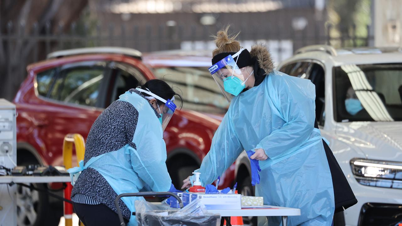 Cars trickle through the line at the drive-in Covid testing site at Fairfield Showground in western Sydney. Picture: NCA NewsWire / David Swift