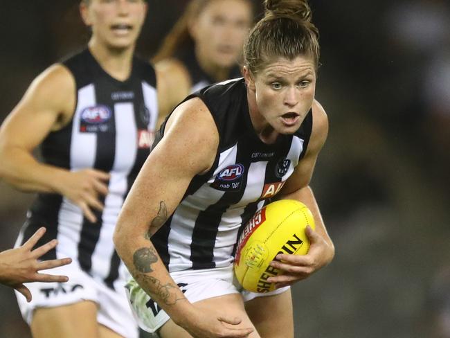 MELBOURNE, AUSTRALIA - FEBRUARY 20: Brianna Davey of the Magpies runs with the ball during the round four AFLW match between the North Melbourne Kangaroos and the Collingwood Magpies at Marvel Stadium on February 20, 2021 in Melbourne, Australia. (Photo by Mike Owen/Getty Images)