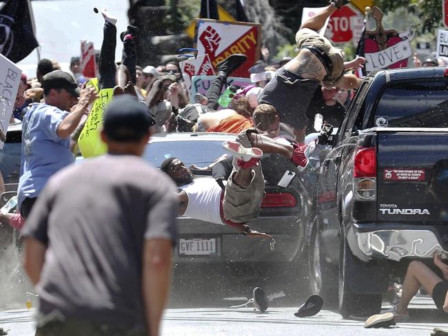 The world watched in horror as a car ploughed into a crowd of protesters demonstrating against a white nationalist rally in Charlottesville on August 12 last year. Picture: Ryan M. Kelly/The Daily Progress via AP, File