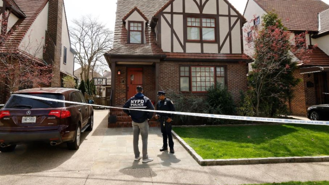 NYPD officers stand outside Gaal’s Forest Hills home where she was killed.