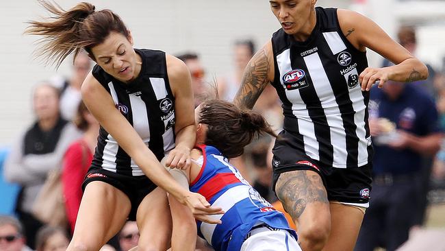 Collingwood's Steph Chiocci cleans up Libby Birch. Pic: Michael Klein