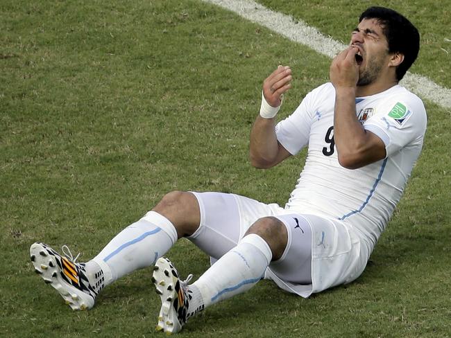 Luis Suarez reacts on the pitch during Uruguay’s World Cup match against Italy. Picture: AP Photo/Hassan Ammar