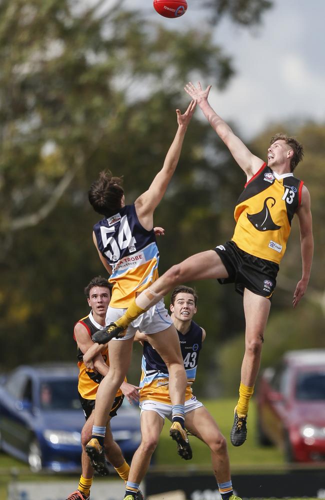 Mitch Christensen (Pioneers) and Riley Bowman (Stingrays) in a ruck contest.