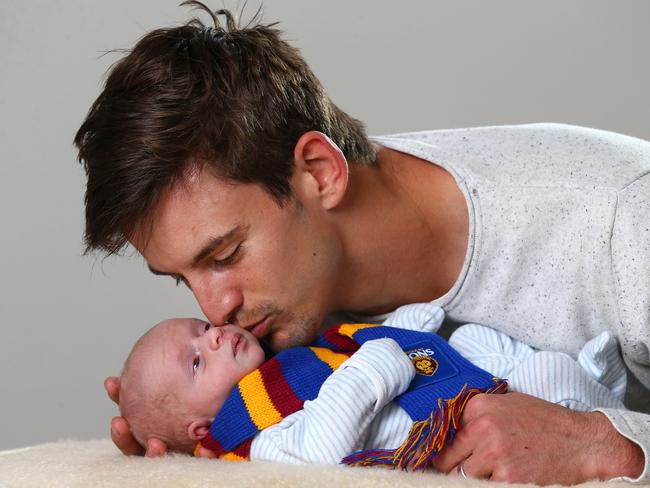 Jarryd Lyons and his Savahna with their baby Sebastian. Pics Adam Head