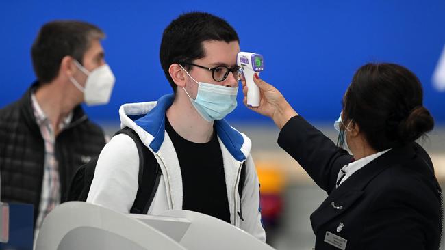 Passengers have their temperature taken in London's Heathrow Airport. Picture: AFP