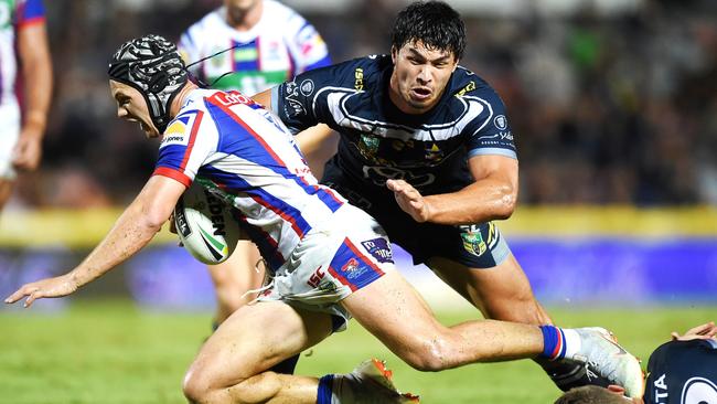 Jordan McLean takes out Kalyn Ponga. Photo: Alix Sweeney