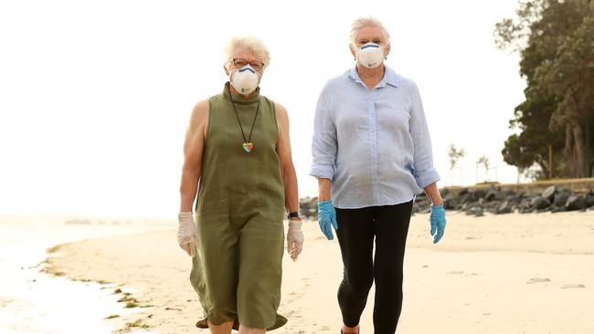 Bribie Island residents Diane Oxenford, 75, and Irene Sourgnes, 75, are calling for the island to be closed off to the mainland to protect the elderly population. Photographer: Liam Kidston.