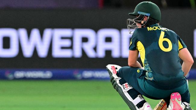 Australia's Beth Mooney reacts after her dismissal during the ICC Women's T20 World Cup cricket semi-final match between Australia and South Africa at the Dubai International Cricket Stadium in Dubai on October 17, 2024. (Photo by Giuseppe CACACE / AFP)