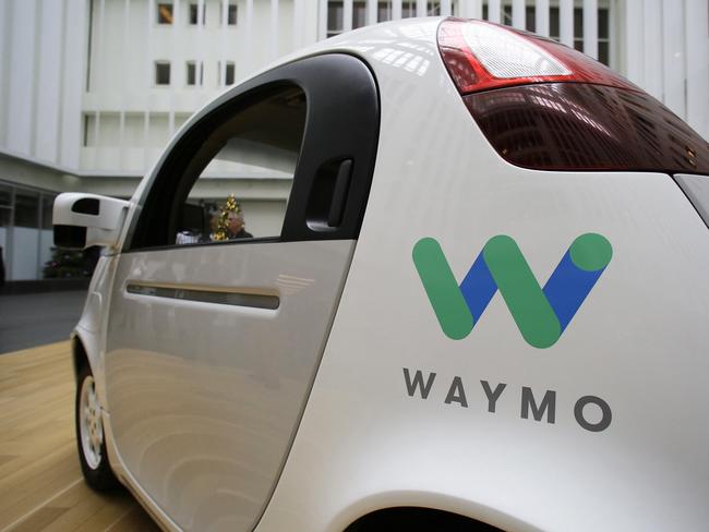 FILE - In this Tuesday, Dec. 13, 2016, file photo, the Waymo driverless car is displayed during a Google event, in San Francisco. Waymo, the self-driving car company owned by Google's parent Alphabet Inc., and Lyft Inc. are teaming up to road test autonomous cars in a potential challenge to Uber Technologies Inc. (AP Photo/Eric Risberg, File)
