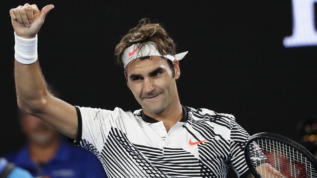 Switzerland's Roger Federer celebrates his win over Japan's Kei Nishikori during their fourth round match at the Australian Open. (AP Photo/Dita Alangkara)