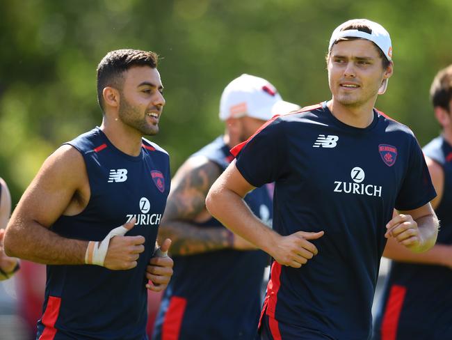 Kade Kolodjashnij, right, runs with new team-mate Christian Salem at Melbourne training.