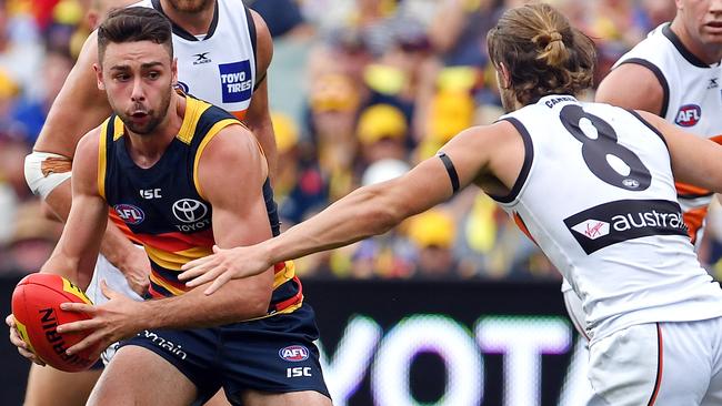 Rory Atkins takes on Giant Callan Ward at Adelaide Oval. Picture: Tom Huntley