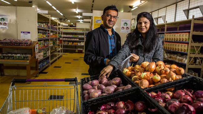 Foodbank customers, recent refugees Samuel and Iram at the Davoren Park Foodbank. Picture: Tom Huntley