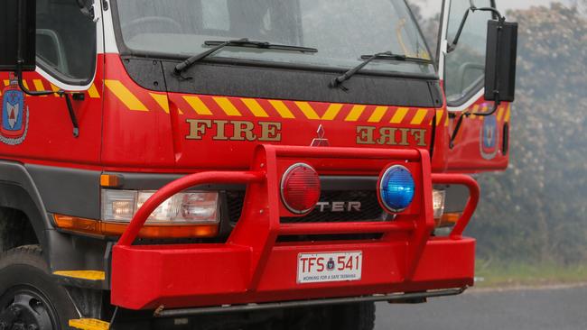 Tasmania Fire Service put out the fire but the excavator was destroyed. Picture: PATRICK GEE