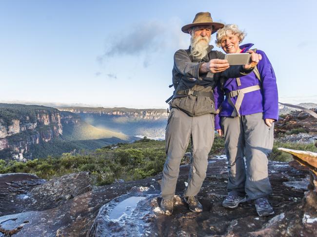 Senior couple taking a selfie while bushwalking in the Australian Blue Mountains