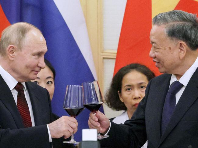 Russia's President Vladimir Putin (L) and Vietnam's President To Lam (R) toast during a reception at the Hanoi Opera House in Hanoi on June 20, 2024. Picture: AFP