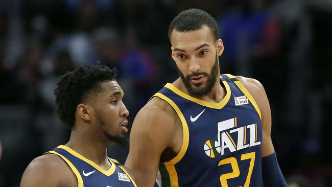 Gobert (right) and Jazz teammate Donovan Mitchell have both tested positive for the virus. Picture: AP