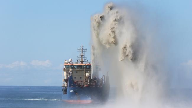 The sand dredge may be masking the sound of pingers on the shark nets. Picture Glenn Hampson