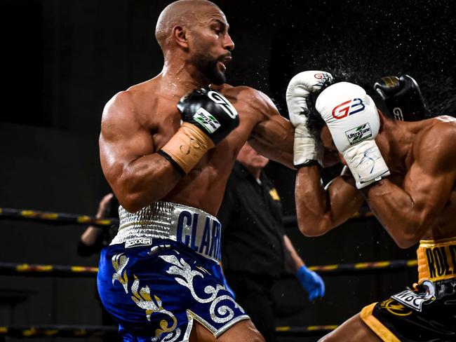 Clarke (left) in action in the ring.