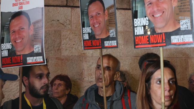 Demonstrators holding portraits of Israeli hostage Ohad Yahalomi protest in front of the prime minister's residence in Jerusalem. Picture: AFP