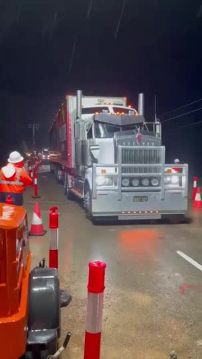 Supply trucks roll over the Ollera Creek bridge bound for the Far North