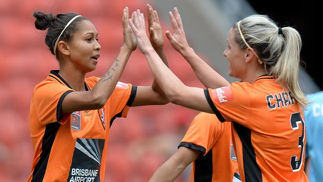 Brisbane Roar’s Allira Toby (left) celebrates with teammate Amy Chapman after she scored against Adelaide United on Sunday.