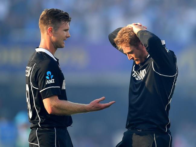 LONDON, ENGLAND - JULY 14:  Jimmy Neesham of New Zealand and Martin Guptill of New Zealand react to their loss after the Final of the ICC Cricket World Cup 2019 between New Zealand and England at Lord's Cricket Ground on July 14, 2019 in London, England. (Photo by Clive Mason/Getty Images)