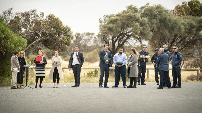 Lawyers, court staff, security officers and (in the light blue shirt) alleged murderer Paul Beveridge Maroroa visit the Gull Rock car park where the shooting took place. Picture: Mike Burton/AAP