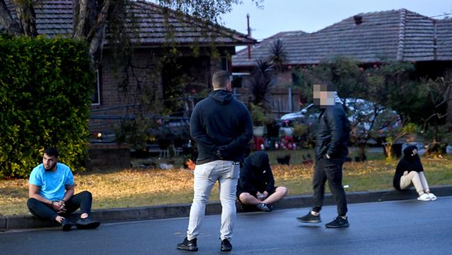 Ali Elmoubayed (blue shirt) and Samimjan Azari (black hoodie) were arrested and charged by NSW Police on Friday. Jade Heffer (far right) was not arrested or charged. Picture: Jeremy Piper