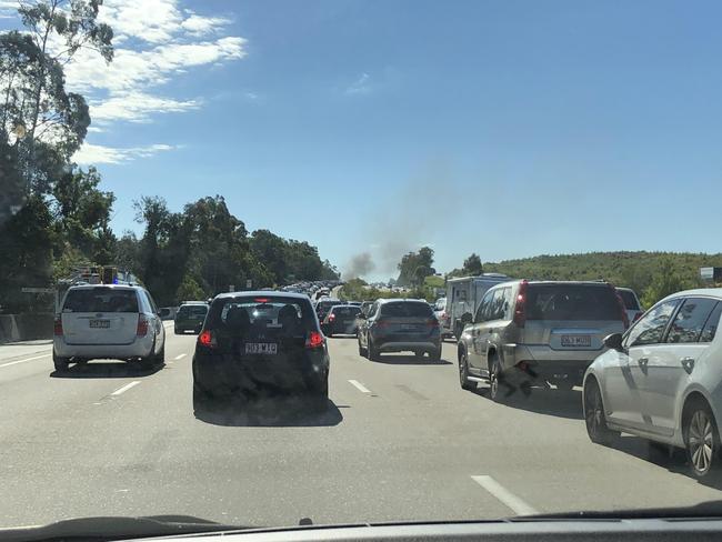 A car on fire on the M1 near Exit 49 on the Gold Coast. Photo: Amanda Robbemond