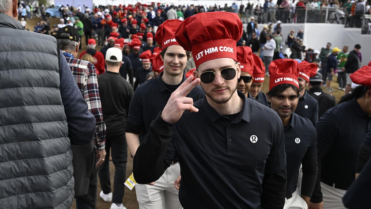 Fans of Min Woo Lee of Australia wear ‘Let Him Cook’ hats during the second round of the WM Phoenix Open at TPC Scottsdale. Picture: Orlando Ramirez/Getty Images