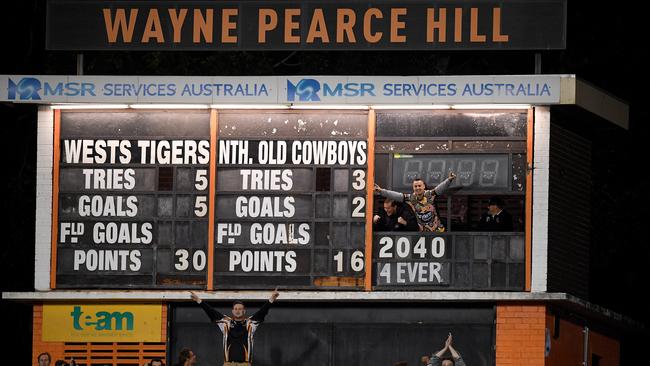 Tigers supporters are seen in the scoreboard following their win over the Cowboys.