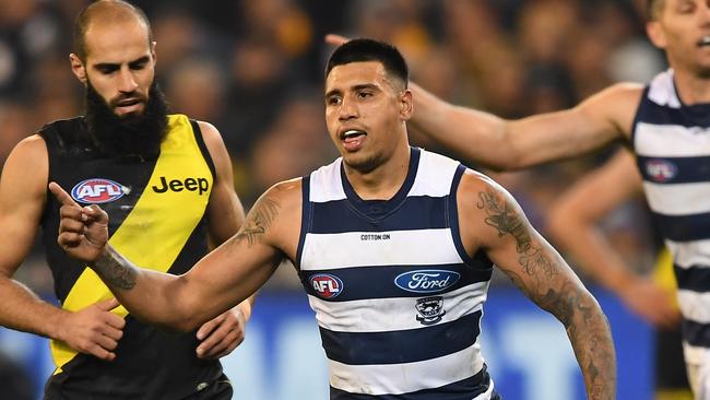 Tim Kelly of the Cats (centre) reacts after kicking a goal against Richmond.