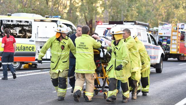 Crash victims are taken to waiting helicopters at the scene of a double fatality on the Bruce Highway near Tiaro on April 17, 2017. Picture: Alistair Brightman