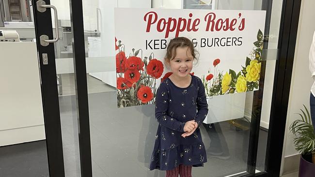 Poppie-Rose Kelly in front of the shop named after her. Picture: Madison Mifsud-Ure / Stanthorpe Border Post